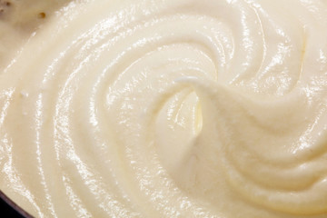 close up of a white whipped or sour cream in bowl.