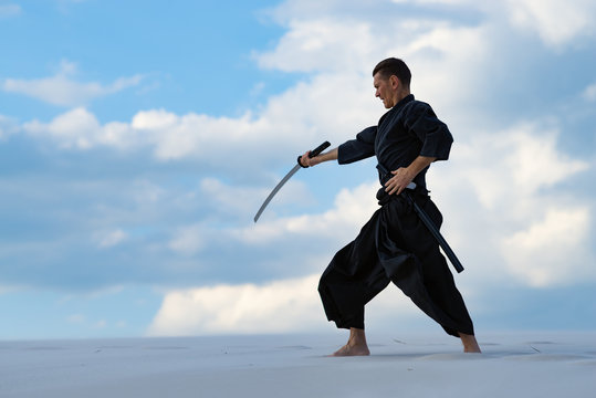 Man is practicing Japanese martial art - iaido