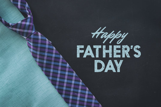 Blackboard and plaid tie for father's day background or graphic. 
