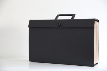 Closeup of black documents foder in a white background