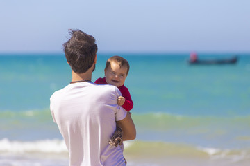 Dad and daughter in the beach