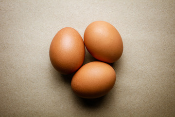 Brown chicken eggs on recycled craft paper