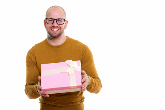 Studio Shot Of Young Bald Muscular Man