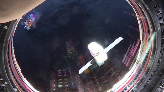 Close up, view of satellite approaching International Space Station