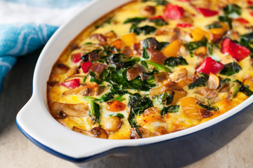 Casserole with tomatoes, mushrooms and spinach