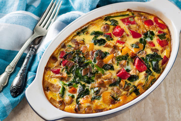 Casserole with tomatoes, mushrooms and spinach