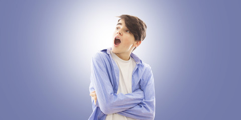 portrait of a young man with a surprise expression on the blue background