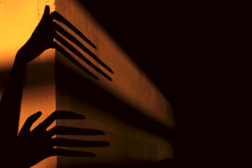 Strange Shadows On The Wall.Terrible Shadows. Abstract Background. Black Shadows Of A Big Hands On...