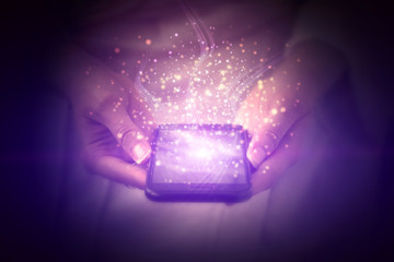 a magic phone, a mobile phone in the hands of a girl, enveloped in magic particles