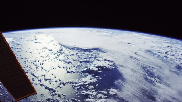 Wide, International Space Station flies over Earth