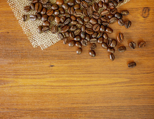 Flat lay coffee beans on wooden background with copy space