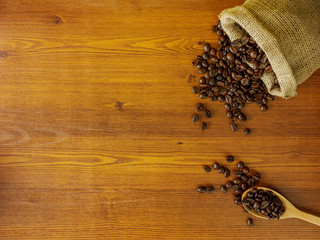 Flat lay coffee beans on wooden background with copy space