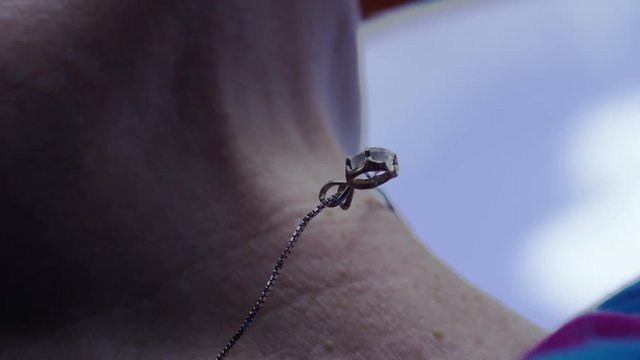 Slow motion close up, bracelet in anti gravity