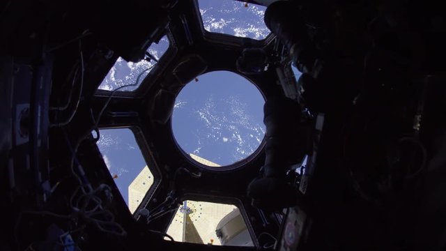 Trucking shot, high angle view of Earth from International Space Station
