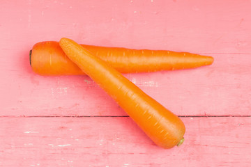 carrot on pink wood