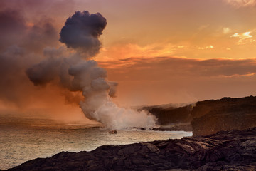 Fototapeta na wymiar Lava pouring into the ocean creating a huge poisonous plume of smoke at Hawaii's Kilauea Volcano, Volcanoes National Park, Hawaii