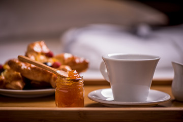 Breakfast on a bed in a hotel room. Bedroom, meal.