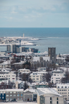 Aerial view of traditional urban developement in Reykjavik, Iceland in winter with snow covered roofs viewed from above.