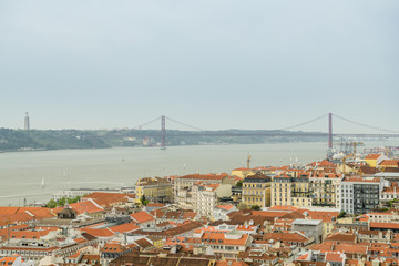 Fototapeta na wymiar Nice view on Tagus river with famous suspension bridge in Lisbon