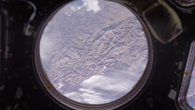 Trucking shot, view of mountains from International Space Station