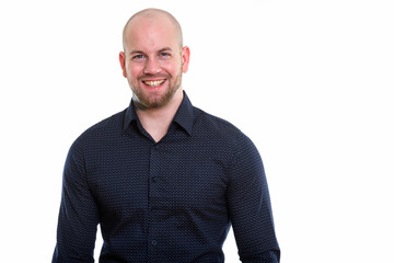 Fototapeta premium Studio shot of young bald muscular businessman