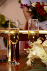 Fairy glasses are full of sparkling champagne during the wedding
