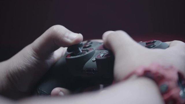 Close up, flicking joysticks on controller