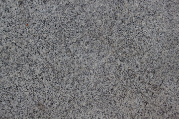 Gray grainy texture with marble chips. Used as a background.