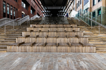 Wooden staircase auditorium behind millennium bridge