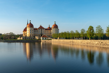 Fototapeta na wymiar Castle Moritzburg in Saxony near Dresden. Pond reflection. Springtime. Germany.