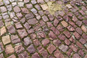 Old asymmetric granite brick pavement