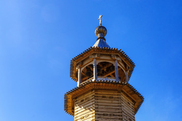 Fototapeta na wymiar Wooden bell tower of orthodox church
