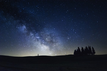 The Milky Way on the cypress trees of San Quirico d'Orcia