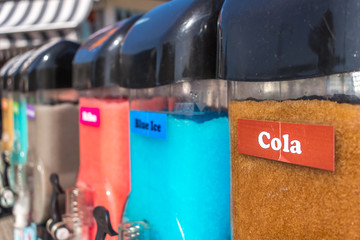 Closeup of Slush Machines with Colorful Flavors