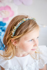 Cute little girl dreams of becoming a princess