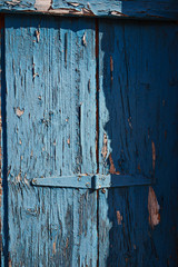 Old rustic  wooden door with hinge