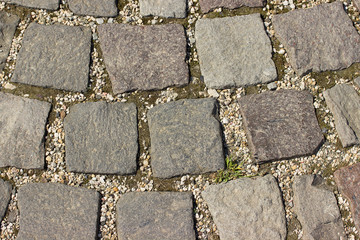 Old vintage sidewalk stone background or texture.