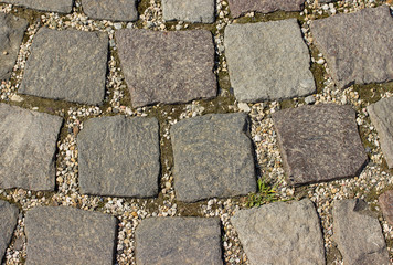 Old vintage sidewalk stone background or texture.