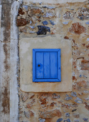 Old window on old town in Malia, Greece