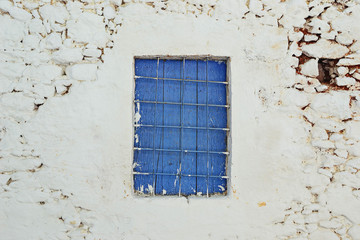 Old window on old town in Malia, Greece