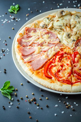 Pizza four season on a dark background