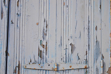 Old rustic  wooden door with hinge