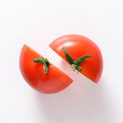 Half fresh tomatoes on white background. Food concept.