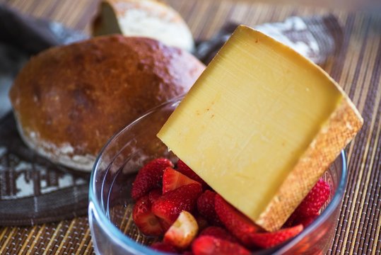 Gruyere cheese, strawberry and bread.