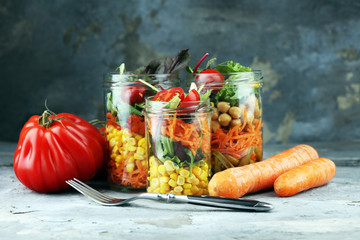 Homemade salad in glass jar with vegetables. Healthy food, diet, detox and clean eating