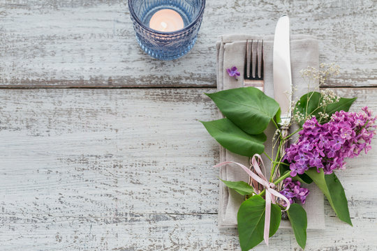 Rustic table setting with lilac flowers