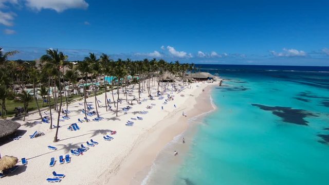 Beautiful beaches of the world. Top view of Bora Bora beach. White sand, blue sea\Bora Bora, view of the beach from the ocean. Hotel on the beach. best beaches in the world. palm trees. Turquoise sea