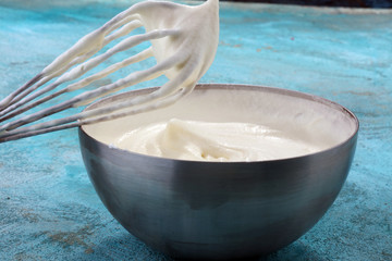 close up of a white whipped or sour cream in bowl.