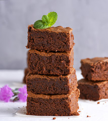 pile of square slices of baked brownie pie