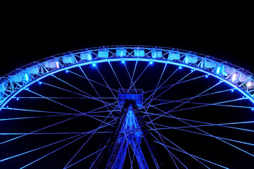 Big ferris wheel with festive blue illumination